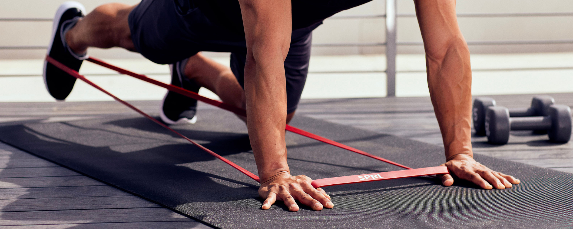 Man in kneeling position kicking leg back